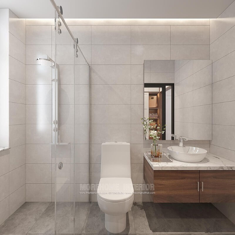 Thiết kế phòng tắm chung cư theo phong cách hiện đại đẹp với cách lựa chọn đồ vật tinh gọn nhưng lại tạo vẻ đẹp sang trọng cuốn hút từ tường ốp gạch giả bê tông, gương hình chữ nhật không khung ốp tường, phòng tắm kính cửa trượt. thiết kế nội thất chung cư